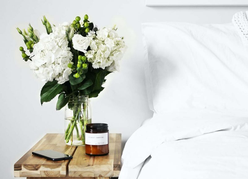 bedroom, better sleep, scented candle, flowers, white colours, sleeping, move to, home and garden, lifestyle, living in surrey, guide to Surrey, home hacks, ideas for your bedroom, bedroom,